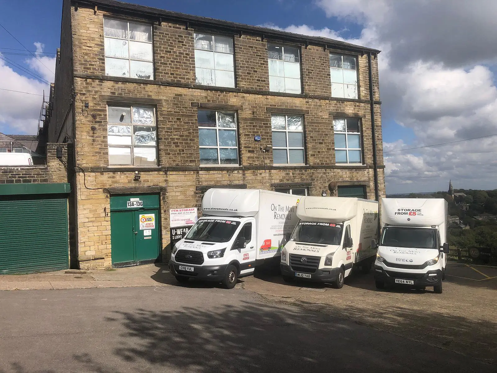 On The Move Removals branded fleet of vans used for house and office moves across West Yorkshire and the UK